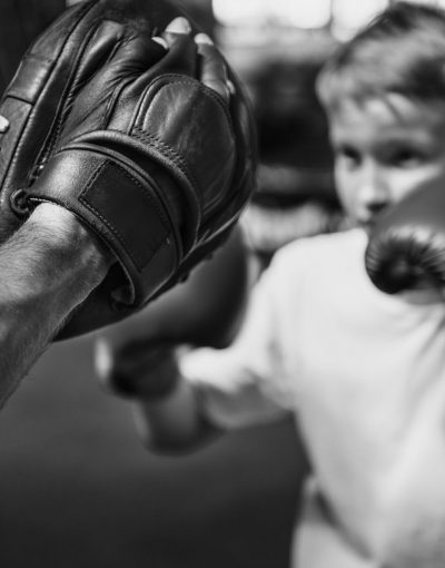 boy-boxing-training-punch-mitts-exercise-concept-PSYNPUU.jpg